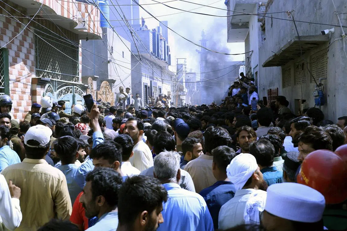 People gathering after a violent mob attacked members of a Christian community over alleged blasphemy in Sargodha, Pakistan on May 25. 