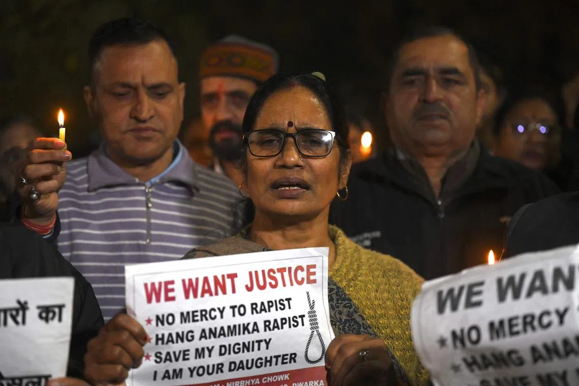 Asha Devi (centre), the mother of  2012 Delhi gang rape victim Jyoti Singh, joins a crowd paying tribute to her daughter and calling for  justice for the families of other rape victims. 
