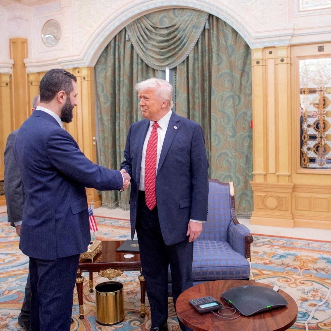 FILE PHOTO: U.S. President Donald Trump meets Syrian President Ahmed al-Sharaa in Riyadh, Saudi Arabia, in this handout released on May 14, 2025. Saudi Press Agency/Handout via REUTERS   THIS IMAGE HAS BEEN SUPPLIED BY A THIRD PARTY/File Photo
