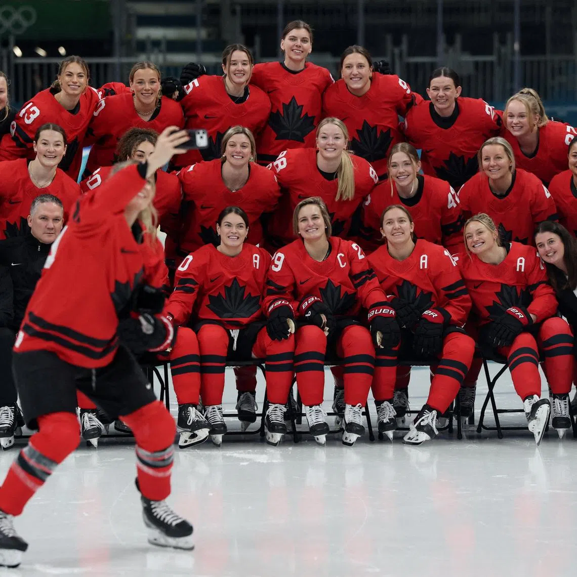 FILE PHOTO: Milano Cortina 2026 Olympics - Ice Hockey - Canada Women's Training  - Milano Rho Ice Hockey Arena, Milan, Italy - February 04, 2026. Canada players and staff pose for a team group photo before training REUTERS/Mike Segar/File Photo