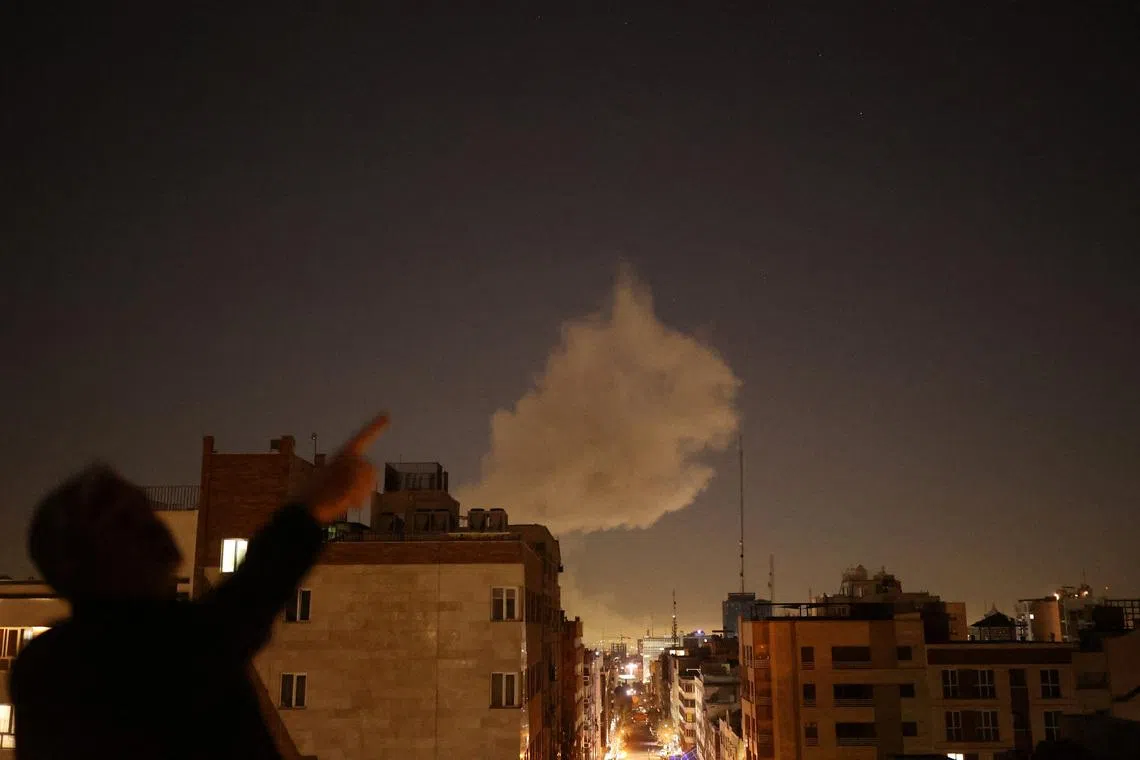 Smoke rises following an explosion, after Israel and the US launched strikes on Iran, in Tehran, on March 1.