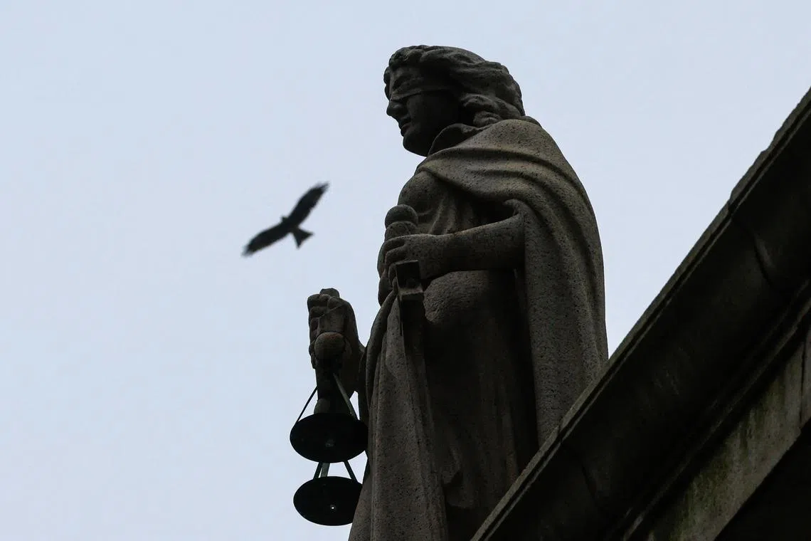 FILE PHOTO: A statue of Lady Justice at the Court of Final Appeal is pictured, in Hong Kong, China, September 5, 2023. REUTERS/Tyrone Siu/File Photo