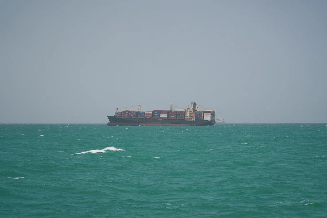 FILE PHOTO: A cargo ship sails in Saudi waters near the Dammam Port in Dammam, Saudi Arabia, May 17, 2026. REUTERS/Mohammed Benmansour/File Photo
