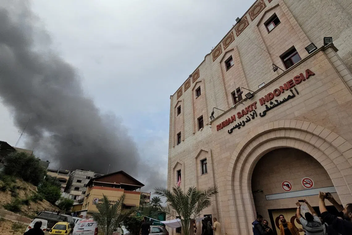 FILE PHOTO: Smoke rises following an Israeli strike near the Indonesian Hospital in the northern Gaza Strip, November 12, 2023. REUTERS/Anas al-Shareef/File Photo