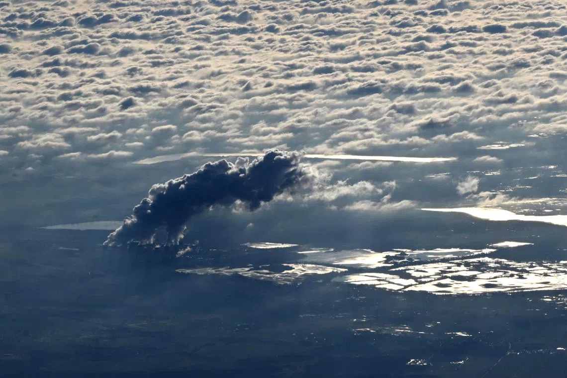 Vapor rising from the cooling towers of the lignite-fired Jaenschwalde Power Plant near the village of Jaenschwalde, eastern Germany on Nov 22, 2023. 