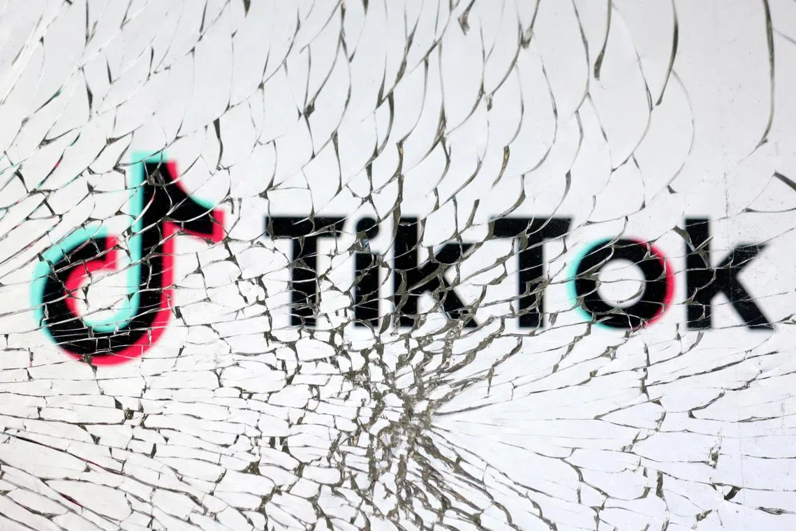 FILE PHOTO: TikTok logo is seen through broken glass in this illustration taken, January 25, 2023. REUTERS/Dado Ruvic/Illustration/File Photo