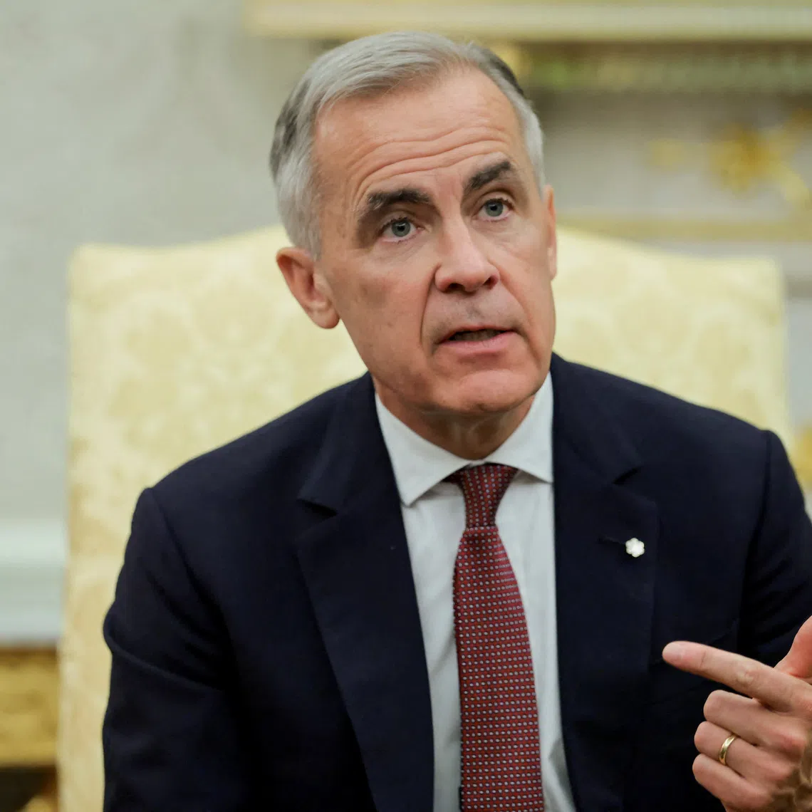 Canada's Prime Minister Mark Carney speaks as he and U.S. President Donald Trump (not pictured) meet in the Oval Office at the White House in Washington, D.C., U.S., October 7, 2025. REUTERS/Evelyn Hockstein