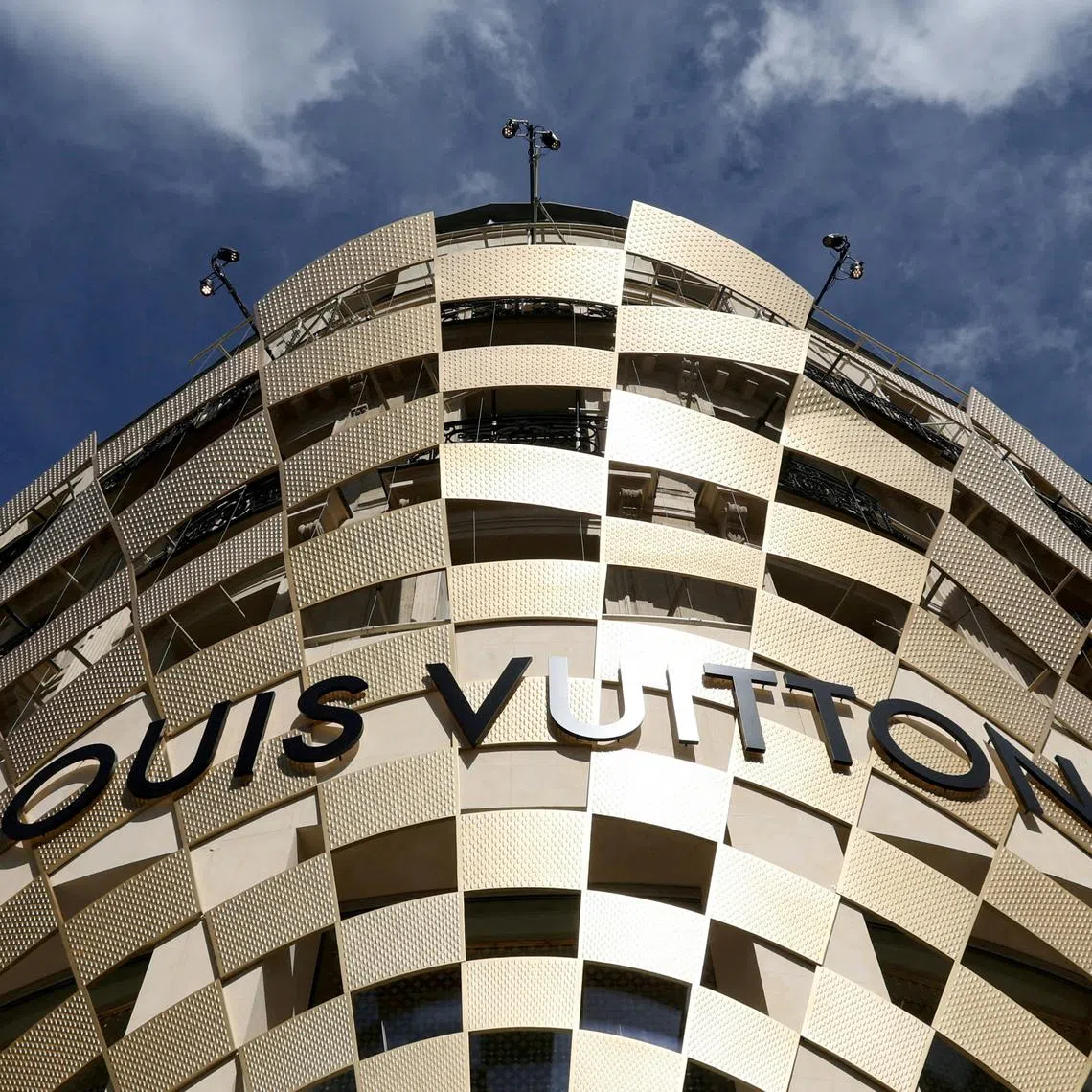 FILE PHOTO: A logo of Louis Vuitton is seen on a store of luxury retailer Louis Vuitton on the Champs-Elysees avenue in Paris, France, April 15, 2024. REUTERS/Manon Cruz//File Photo