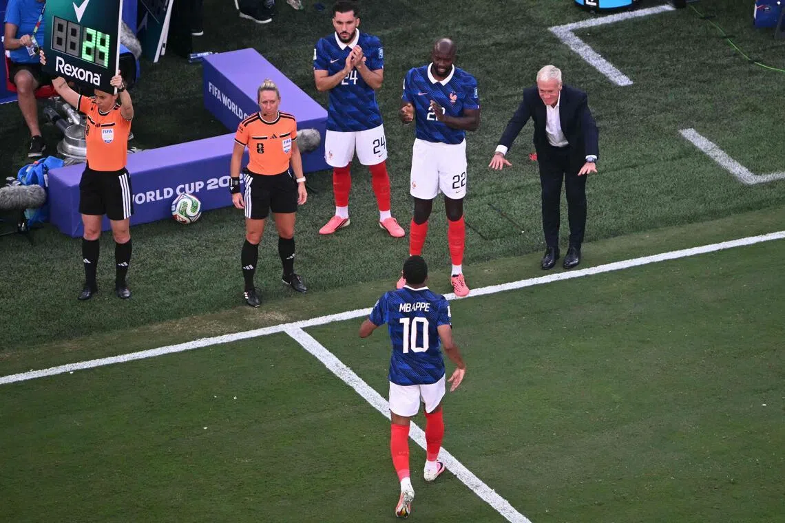 France manager Didier Deschamps bowing to forward Kylian Mbappe after subbing him out in their World Cup last-32 win over Sweden on June 30.