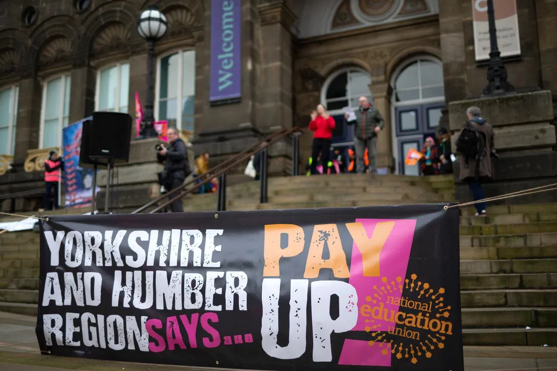Members of the National Education Union (NEU) striking over pay in Leeds, Britain, on Feb 28, 2023.