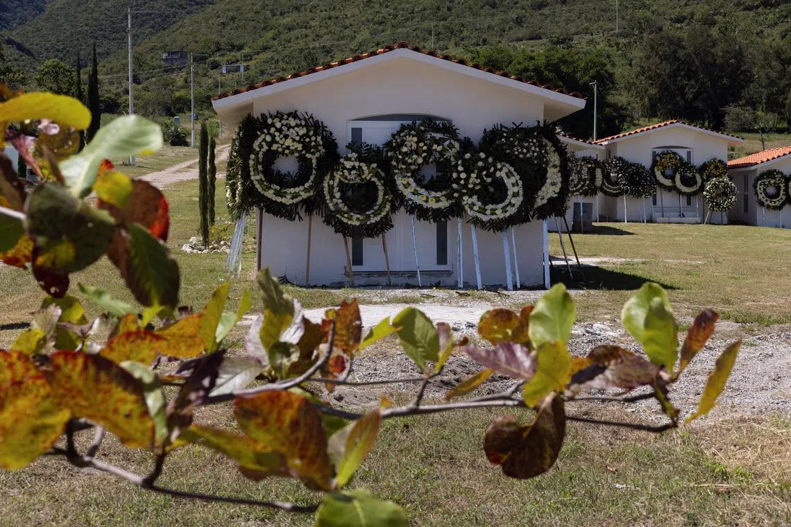 FILE PHOTO: Floral arrangements are placed at the cemetery where Alejandro Arcos was buried, Arcos was killed after having just taken office as the mayor of Chilpancingo, the capital of Mexico's state of Guerrero, in Chilpancingo, Mexico October 11, 2024. REUTERS/Quetzalli Nicte-Ha/File Photo