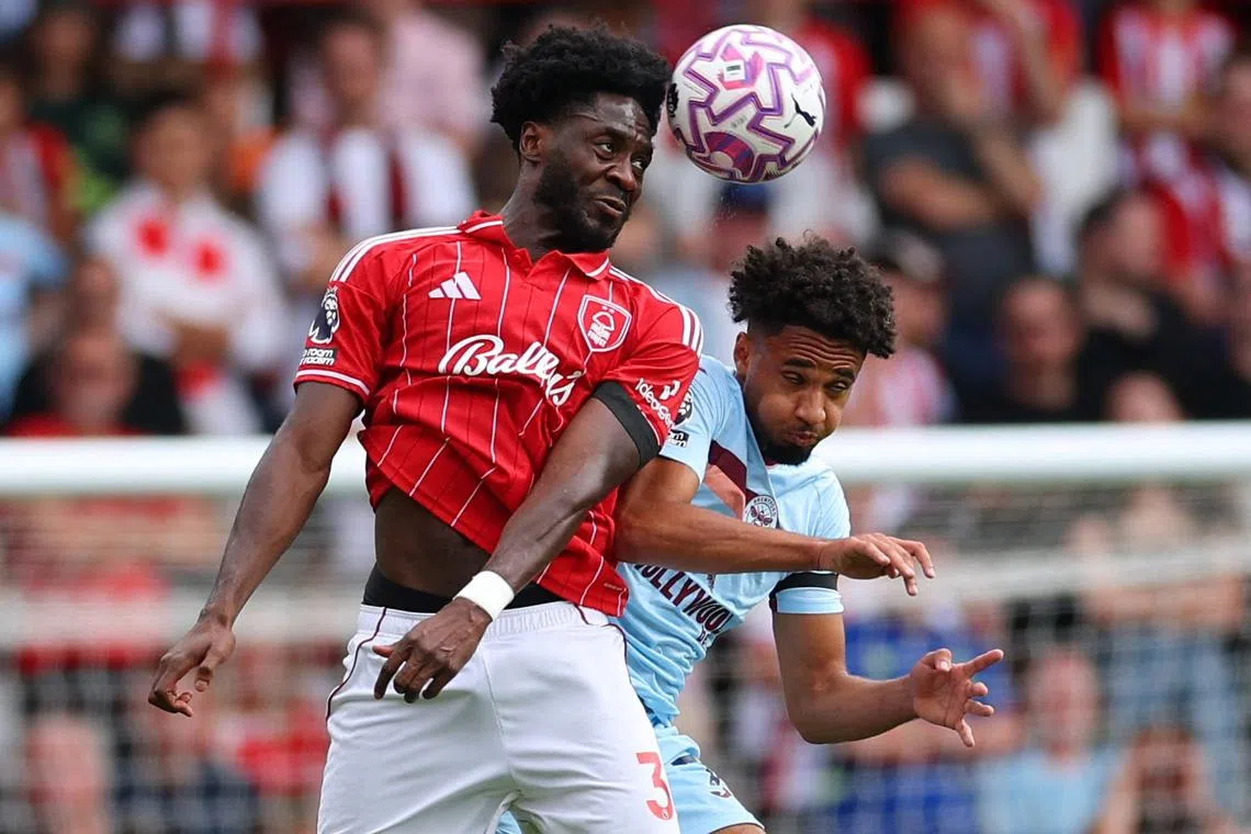 FILE PHOTO: Soccer Football - Premier League - Nottingham Forest v Brentford - The City Ground, Nottingham, Britain - August 17, 2025 Nottingham Forest's Ola Aina in action with Brentford's Kevin Schade Action Images via Reuters/Andrew Boyers/ File Photo