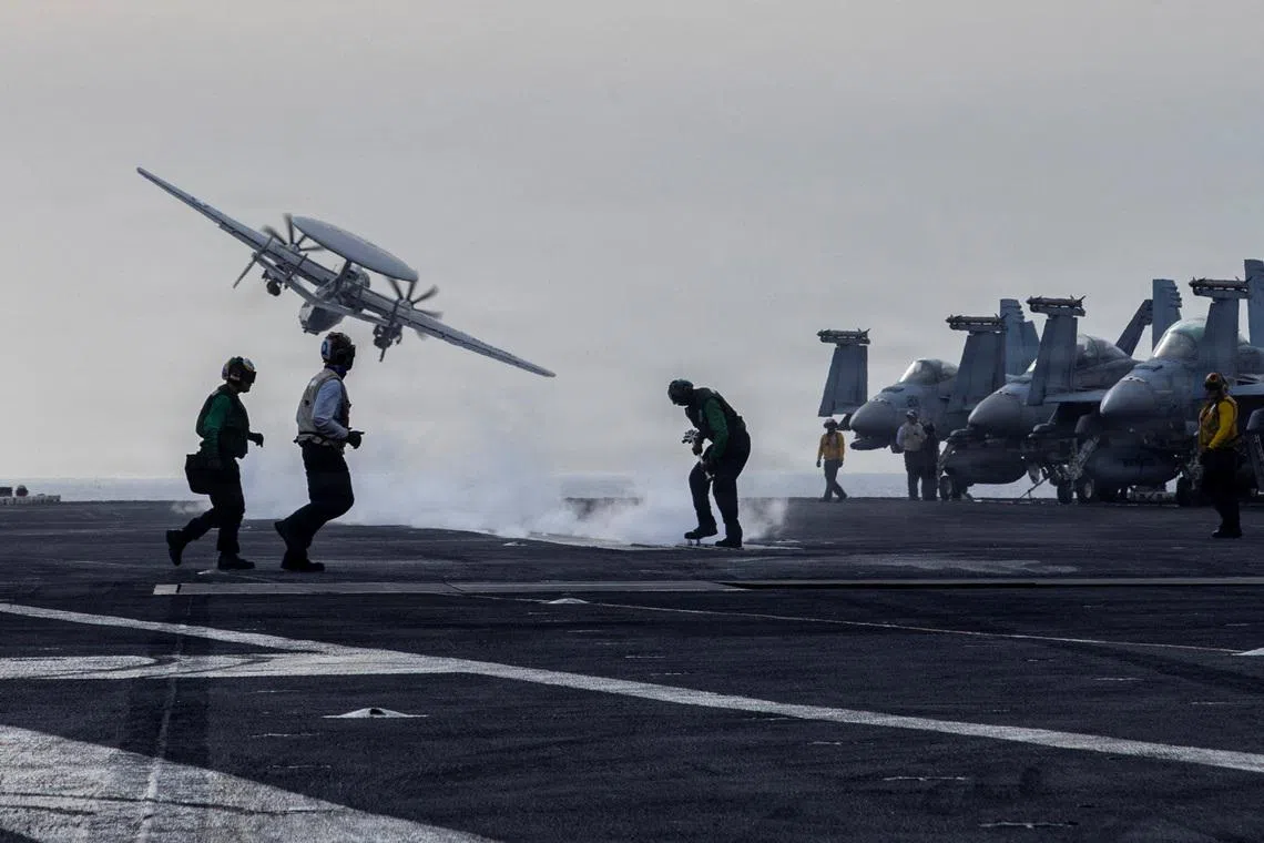 An E-2D Hawkeye surveillance aircraft launches from the flight deck of the U.S. Navy Nimitz-class aircraft carrier USS Abraham Lincoln during thge Operation Epic Fury attack on Iran March 31, 2026.