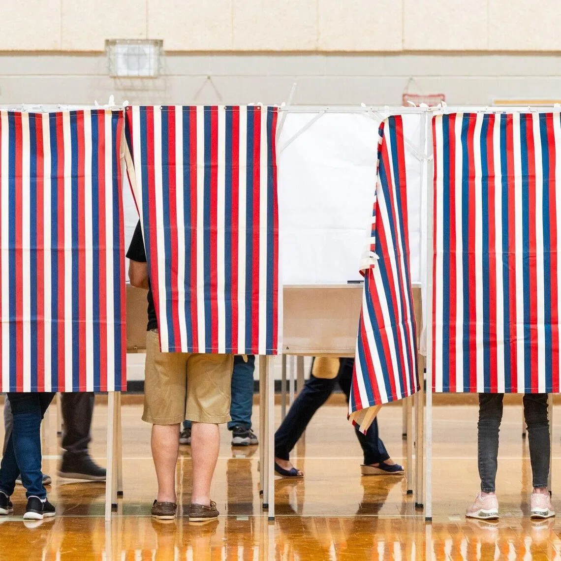 Voters casting their ballots at a polling station during a primary election in Hooksett, New Hampshire, US, on Sept 8.