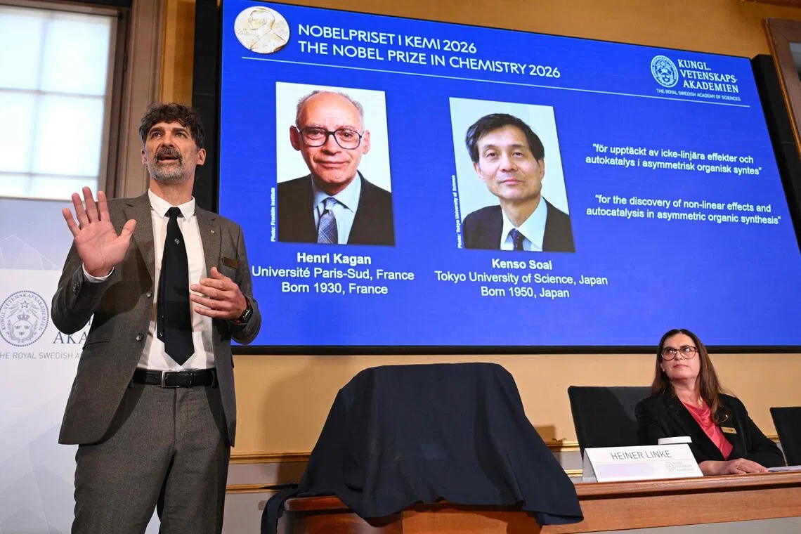 Heiner Linke, chair of the Nobel committee for chemistry, explaining the research field of winners Henri Kagan and Japan’s Kenso Soai at a press conference in Stockholm on Oct 7.