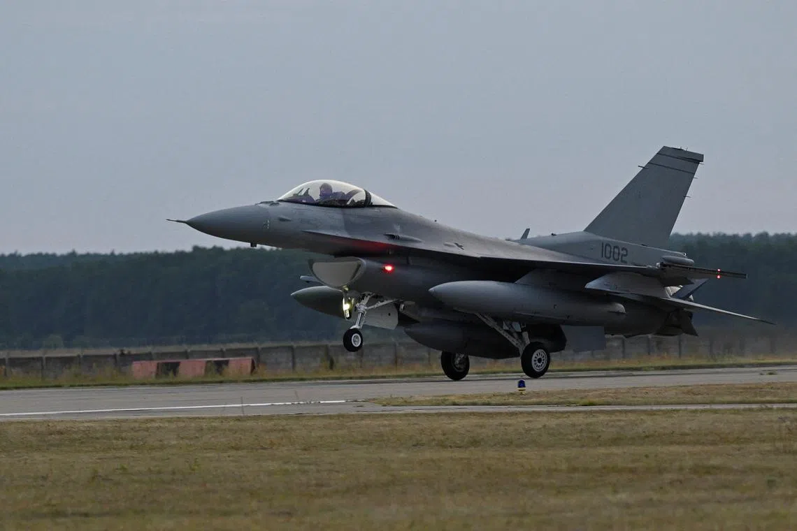 FILE PHOTO: An F-16 lands, on the day of a handover ceremony for two F-16s arriving from the United States to Malacky-Kuchyna Air Base, two of the fourteen fighter jets planned to arrive in the country under a deal signed in 2018 to replace its Russian-made MiG-29 jets, in Malacky, Slovakia, July 22, 2024. REUTERS/Radovan Stoklasa/File Photo
