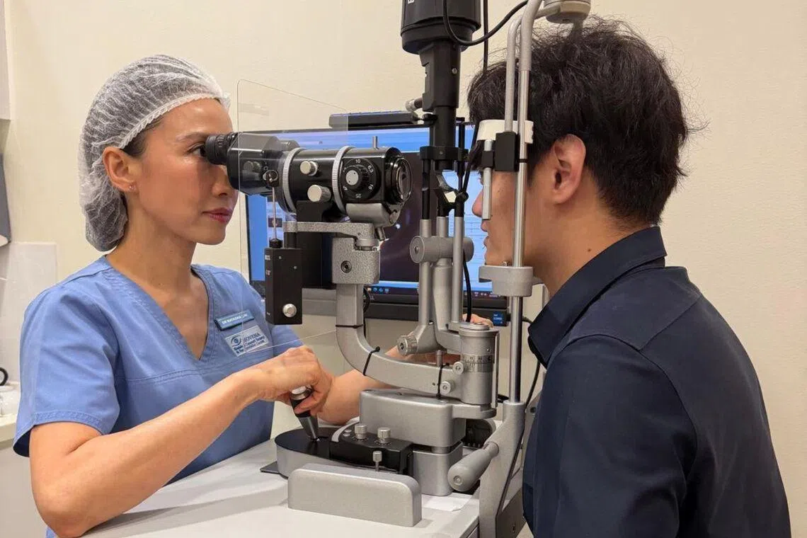 Dr Natasha Lim examines a patient for surgery suitability