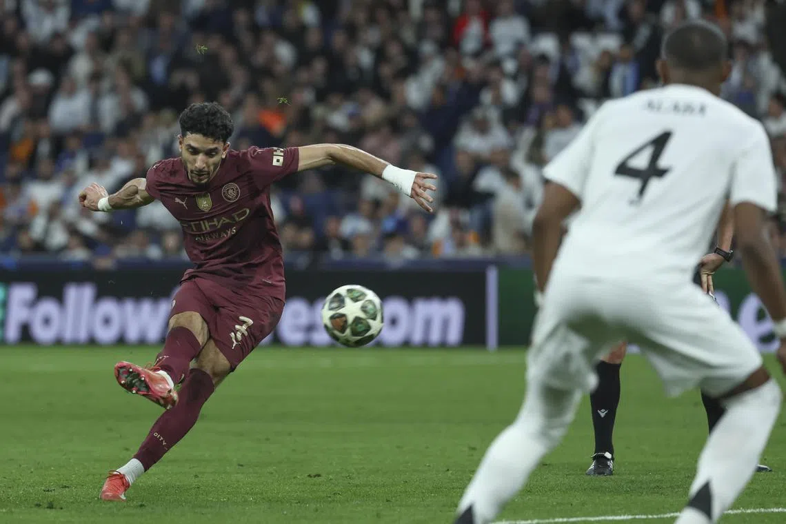 Manchester City's Omar Marmoush (left) pictured in action during the Champions League match against Real Madrid, is among the new signings for City.