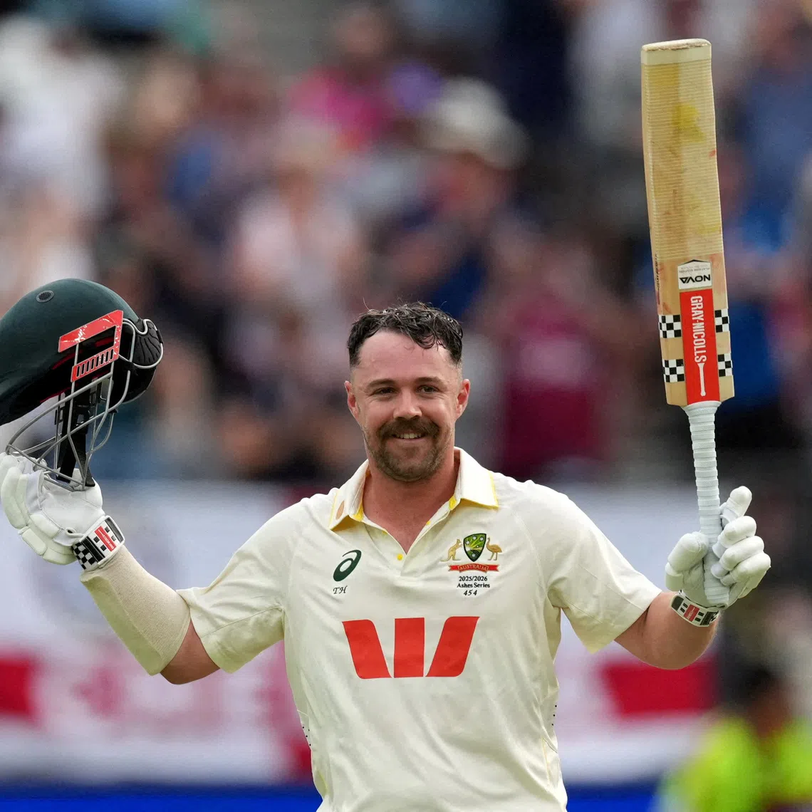 FILE PHOTO: Cricket - The Ashes - Australia v England - First Test - Perth Stadium, Perth, Australia - November 22, 2025 Australia's Travis Head celebrates after reaching his century. REUTERS/Asanka Brendon Ratnayake/File Photo