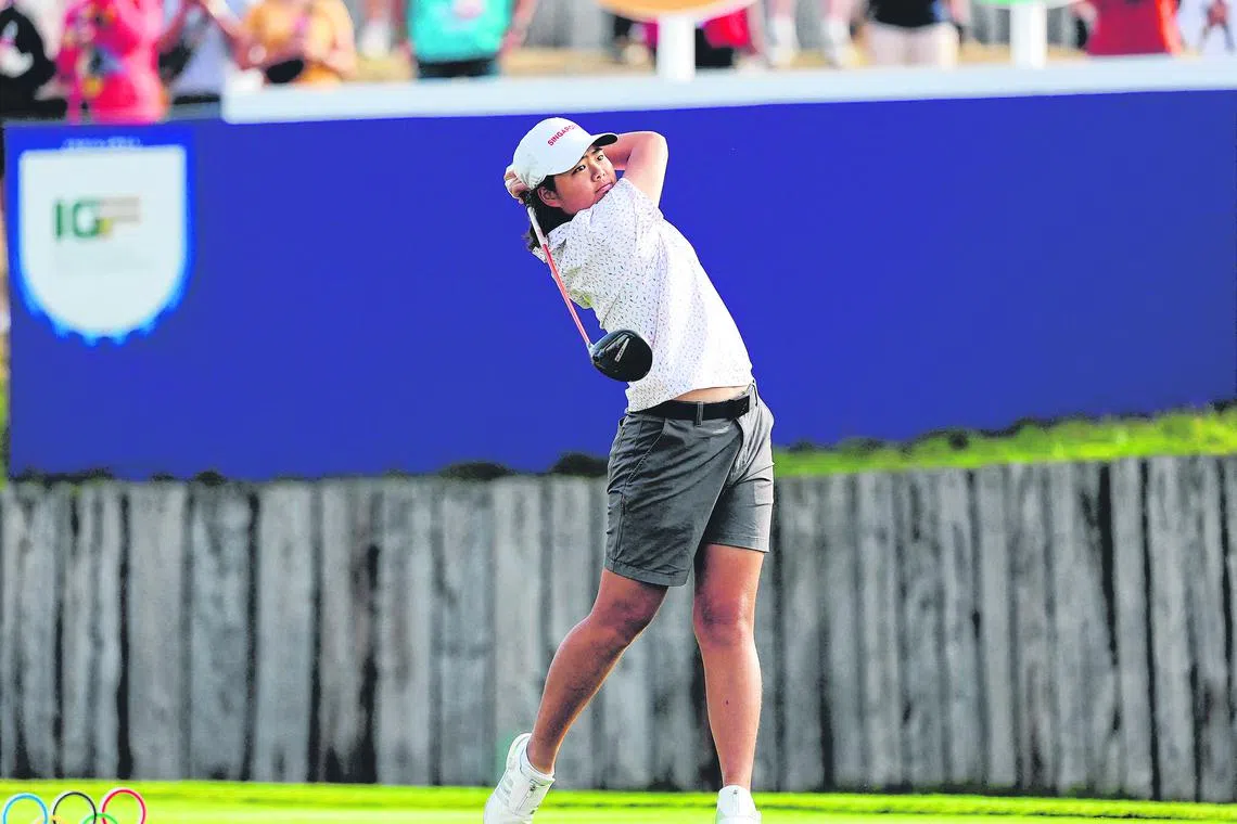 Singapore's Shannon Tan competes in round 1 of the women’s golf individual stroke play of the Paris 2024 Olympic Games at Le Golf National in Guyancourt, south-west of Paris on August 7, 2024. (Photo by Pierre-Philippe MARCOU / AFP)