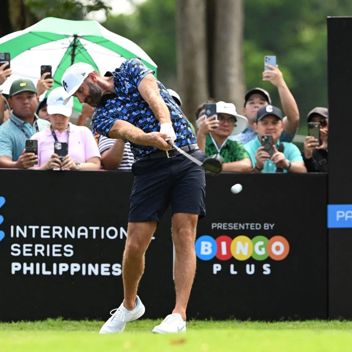 Dustin Johnson of the US tees during the International Series Philippines at Sta Elena Golf Club in Santa Rosa town.