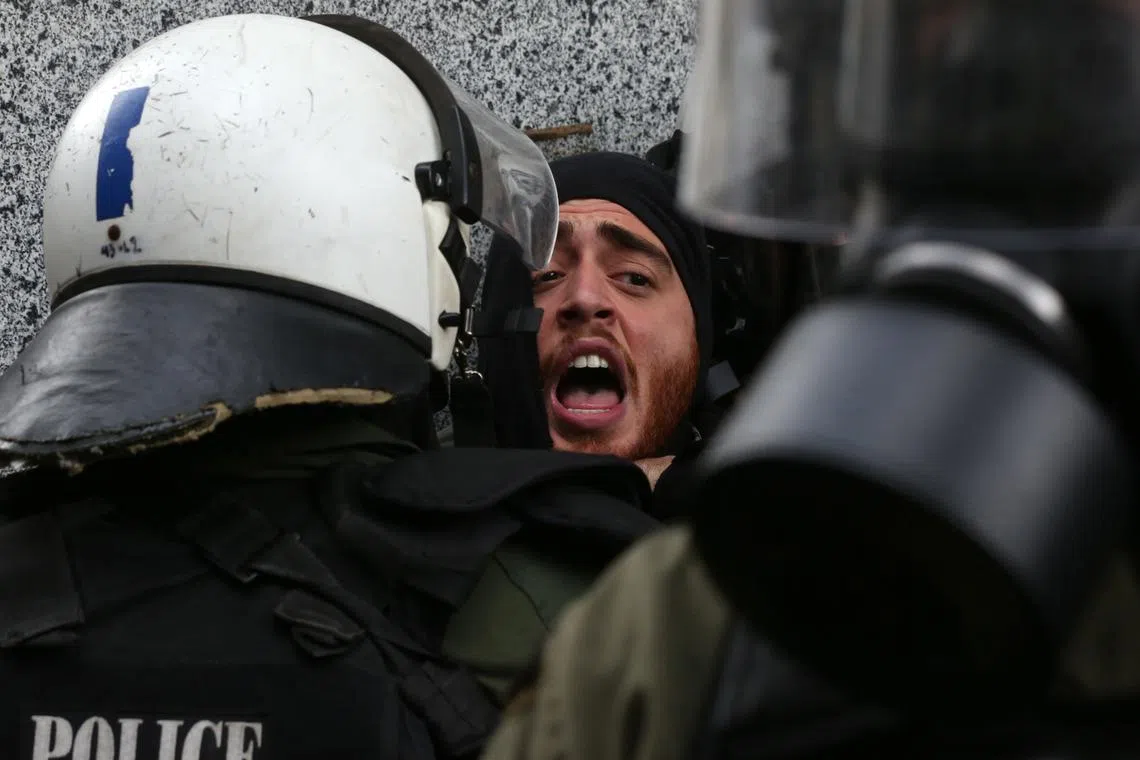 Police detaining a protester during a protest rally to demand justice for the victims of the Tempe train accident, outside the Parliament at Syntagma Square in Athens, Greece, on Jan 26, 2025. 