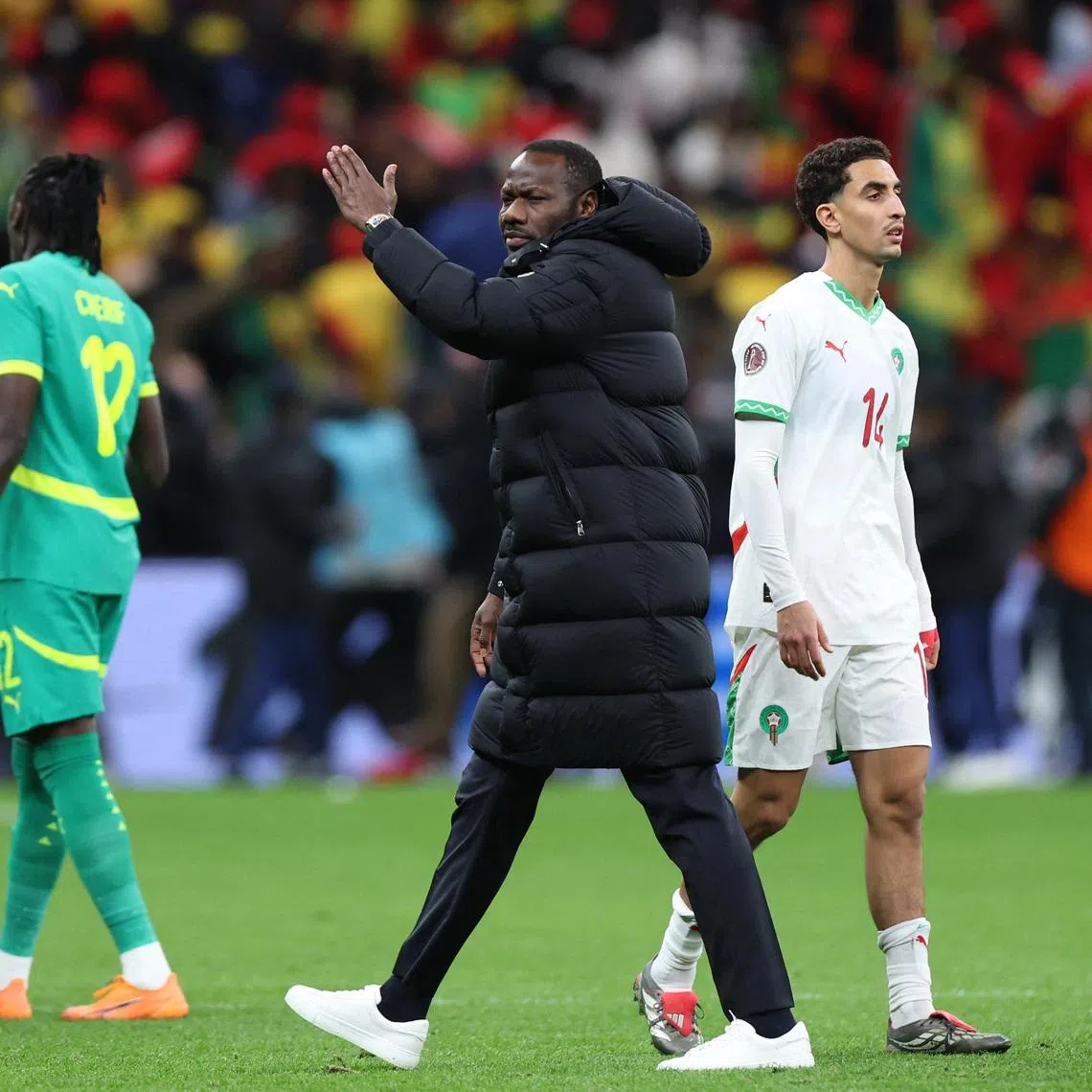 FILE PHOTO: Soccer Football - CAF Africa Cup of Nations - Morocco 2025 - Final - Senegal v Morocco - Prince Moulay Abdellah Stadium, Rabat, Morocco - January 18, 2026 Senegal coach Pape Thiaw gestures for his players to leave the pitch after a penalty is awarded to Morocco REUTERS/Amr Abdallah Dalsh/ File Photo