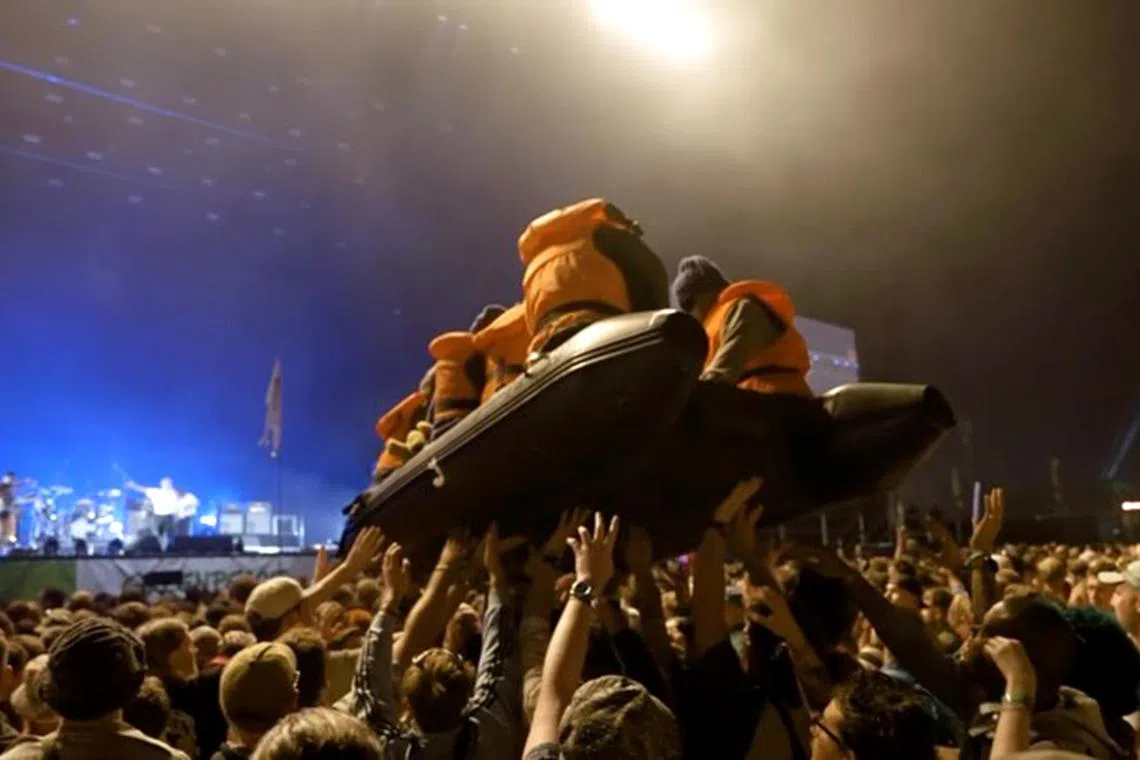 Banksy shared on Instagram on July 1 a video of an inflatable boat with dummy migrants at Glastonbury.