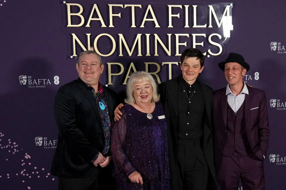 (From left) Tourette’s campaigner John Davidson and his friend Dottie Achenbach, as well as British actor Robert Aramayo at the BAFTA Film Awards Nominees' Party in London on Feb 21. 