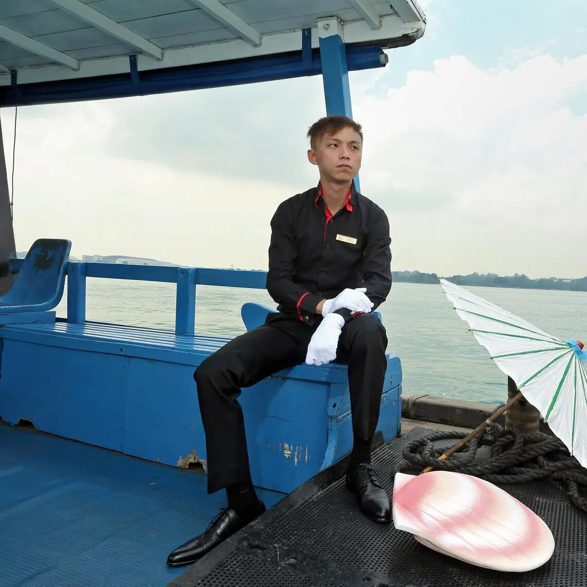 Nicky Teo of Funeral Solutions, a private operator for sea burials, with items used in the process.