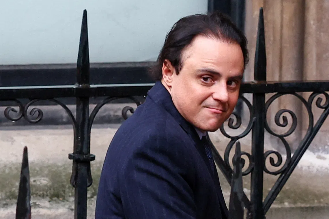Former Ferrari Formula One driver Felipe Massa looks on near the High Court, where he is suing the governing FIA and former F1 chief Bernie Ecclestone, claiming he was the rightful 2008 world champion due to the Crashgate scandal at the Singapore Grand Prix and is seeking up to 64 million pounds in damages, in London, Britain, October 29, 2025. REUTERS/Isabel Infantes