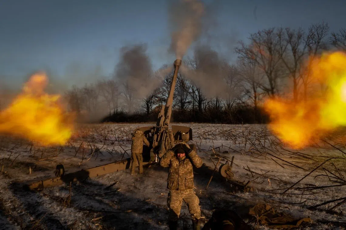 Ukrainian soldiers fire a 152mm howitzer into the Russian-controlled village of Pisky, in eastern Ukraine, on Jan 9, 2023.