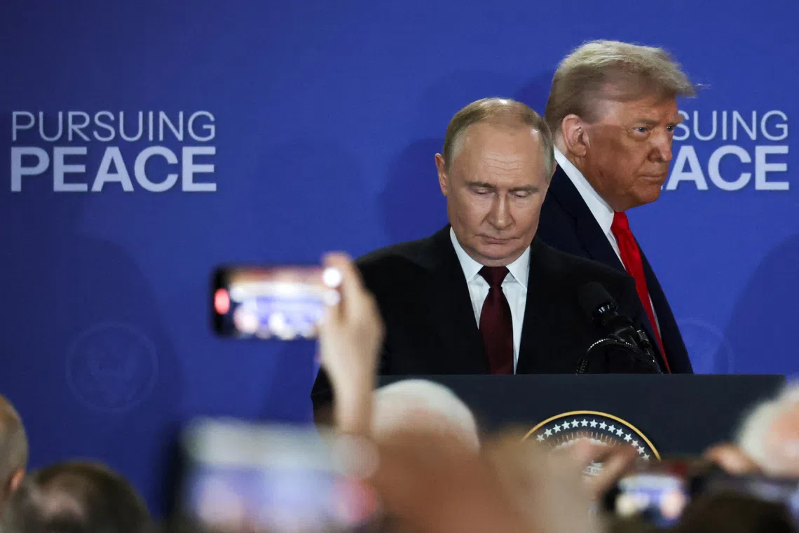 U.S. President Donald Trump and Russian President Vladimir Putin hold a press conference following their meeting to negotiate an end to the war in Ukraine, at Joint Base Elmendorf-Richardson in Anchorage, Alaska, U.S., August 15, 2025. REUTERS/Jeenah Moon