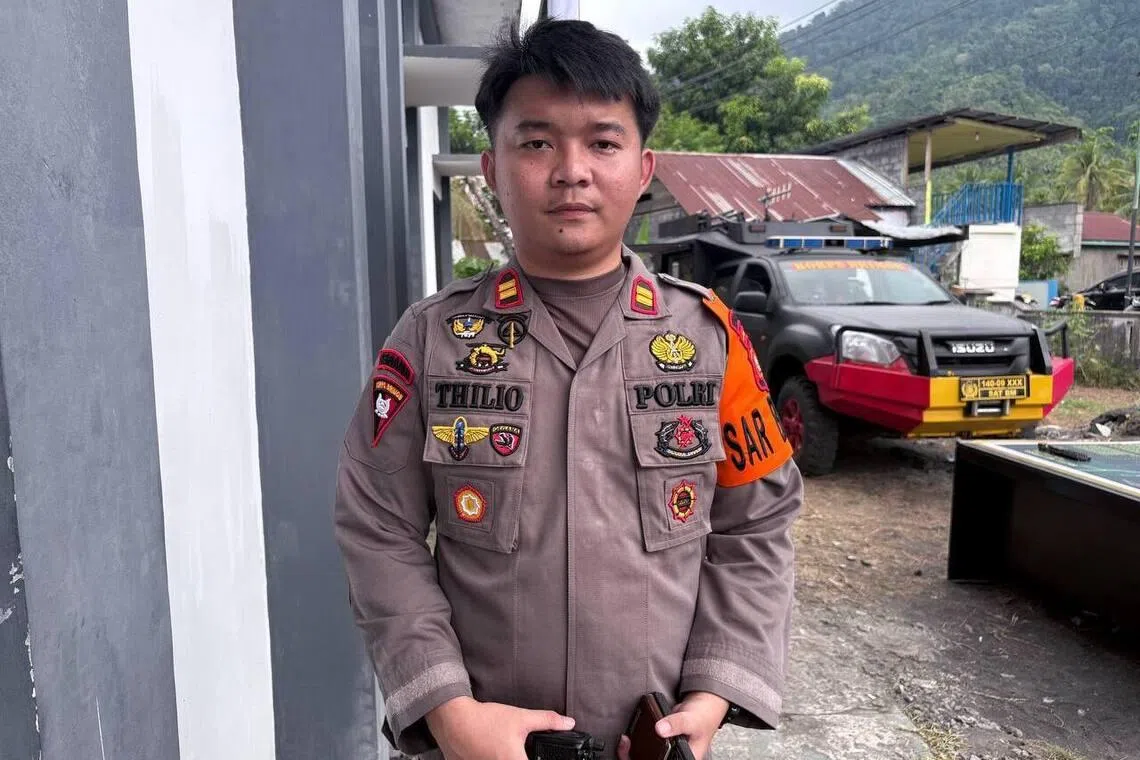 Mr Mochamad Thilio, a police officer with the Tobelo Mobile Brigade (Brimob), who is coordinating communications with the search and rescue team in Mamuya village, Galela, North Halmahera, North Maluku, Indonesia.