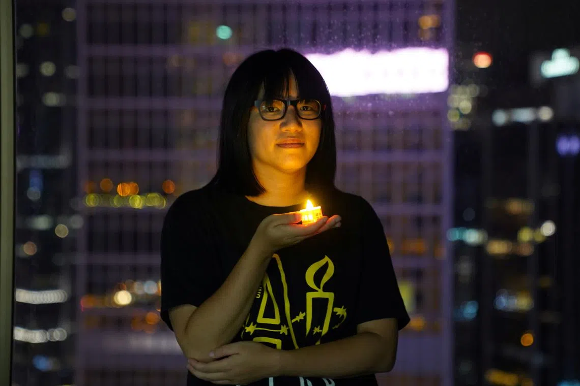 FILE PHOTO: Vice-chairwoman of Hong Kong Alliance in Support of Patriotic Democratic Movements of China, Chow Hang-tung poses with a candle ahead of the 32nd anniversary of the crackdown on pro-democracy demonstrators at Beijing's Tiananmen Square in 1989, in Hong Kong, China June 3, 2021. REUTERS/Lam Yik/File Photo