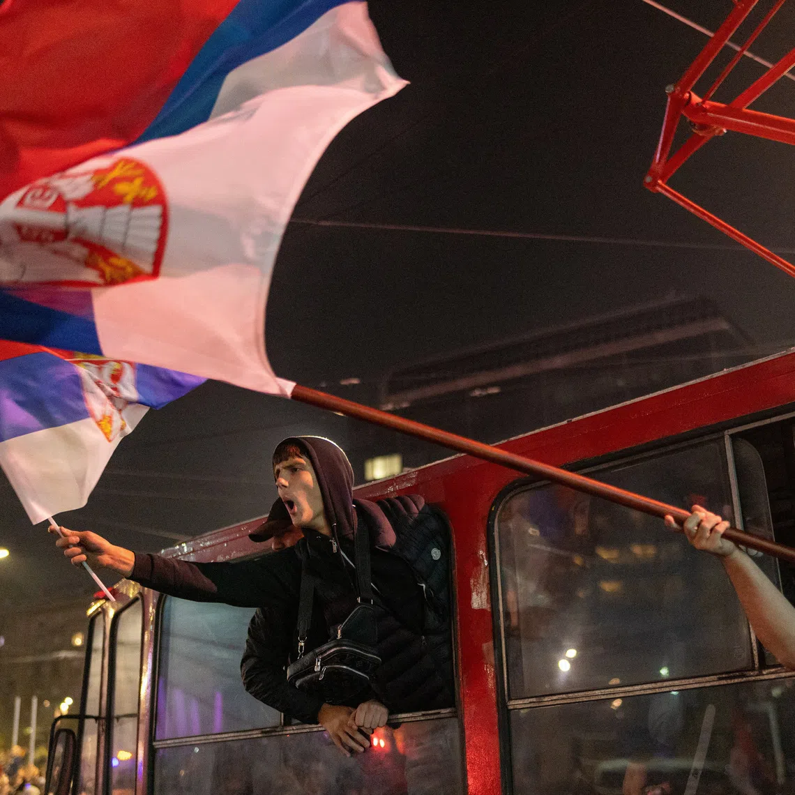 Supporters of the electoral list \"Student List - Students Win\" celebrate after Aleksandar Vucic, Serbian Progressive Party (SNS) prime ministerial candidate, conceded defeat in the parliamentary election in Belgrade, Serbia, October 26, 2026. REUTERS/Uros Arsic
