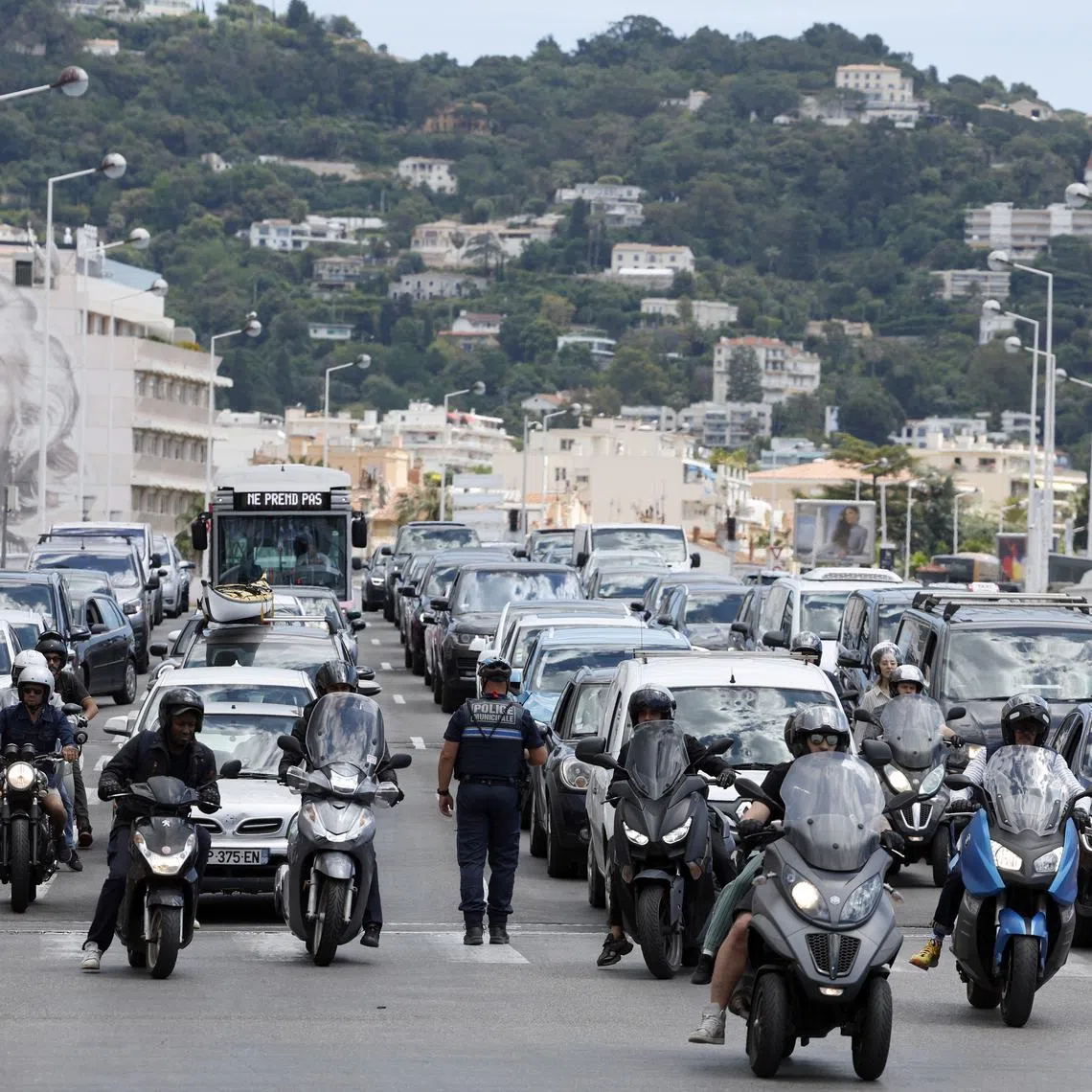 A policeman directing traffic following a power outage that hit Cannes, France, on May 24.