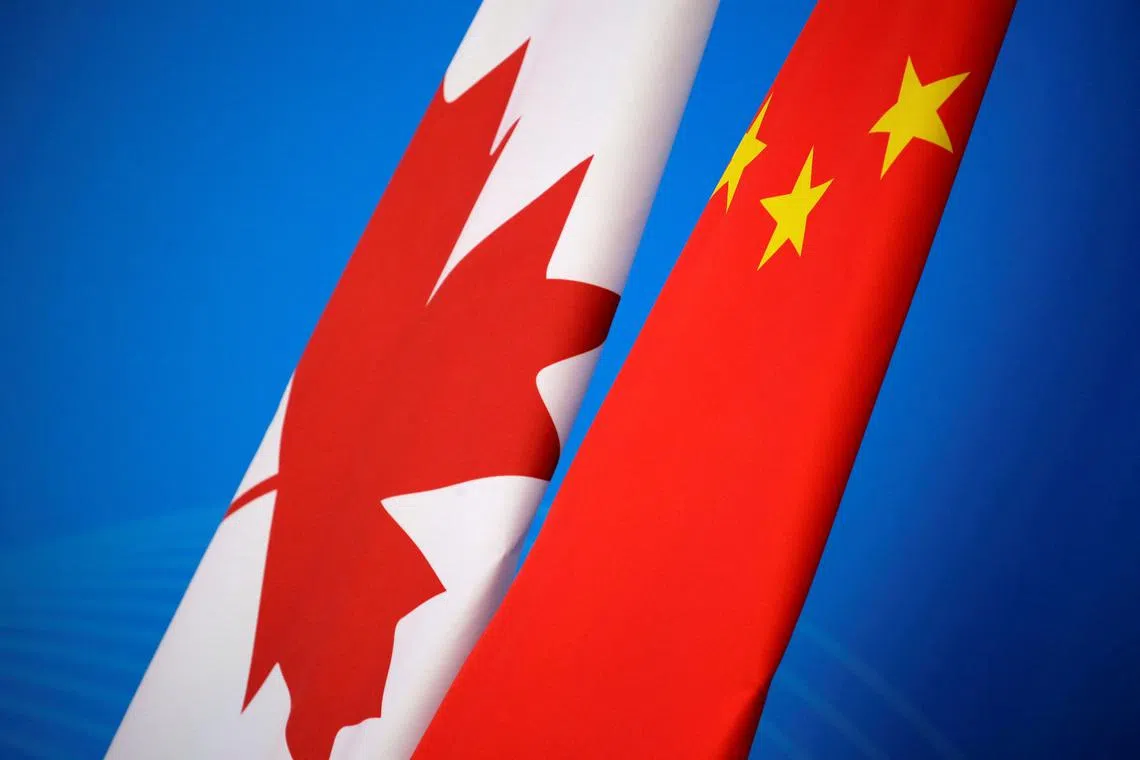 FILE PHOTO: Flags of Canada and China are placed for the first China-Canada economic and financial strategy dialogue in Beijing, China, November 12, 2018. REUTERS/Jason Lee/Pool/File Photo