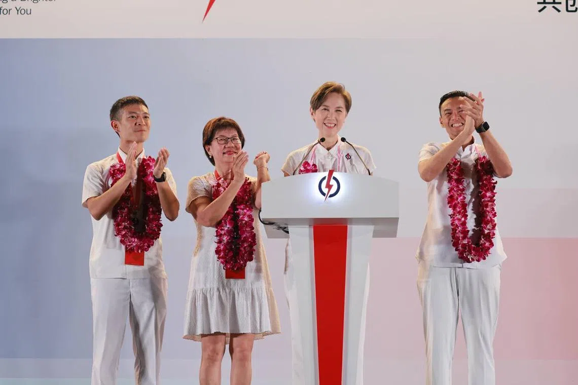 The PAP's Jalan Besar GRC candidates (from left) Shawn Loh, Denise Phua, Josephine Teo and Wan Rizal Wan Zakariah at Bedok Stadium early on May 4.