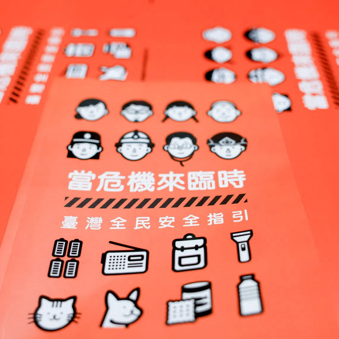 The book cover of Taiwan's civil defence handbook at a printing house in Taoyuan, Taiwan, November 14, 2025. REUTERS/Ann Wang