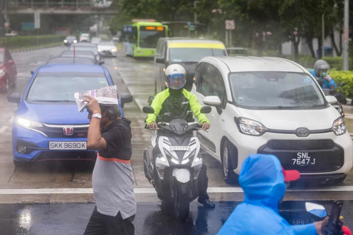 ST20250911_202559600515/pixgenerics/Brian Teo/Generic of passers-by walking in the rain at Clementi on Sept 11, 2025. Can be used for stories on rain, wet weather, climate change, monsoon. ST PHOTO: BRIAN TEO