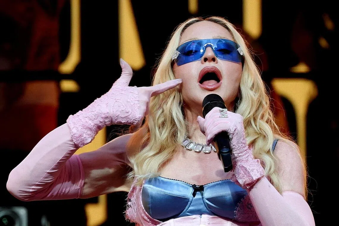 Madonna performing during a surprise concert in Times Square, New York City, on June 4.