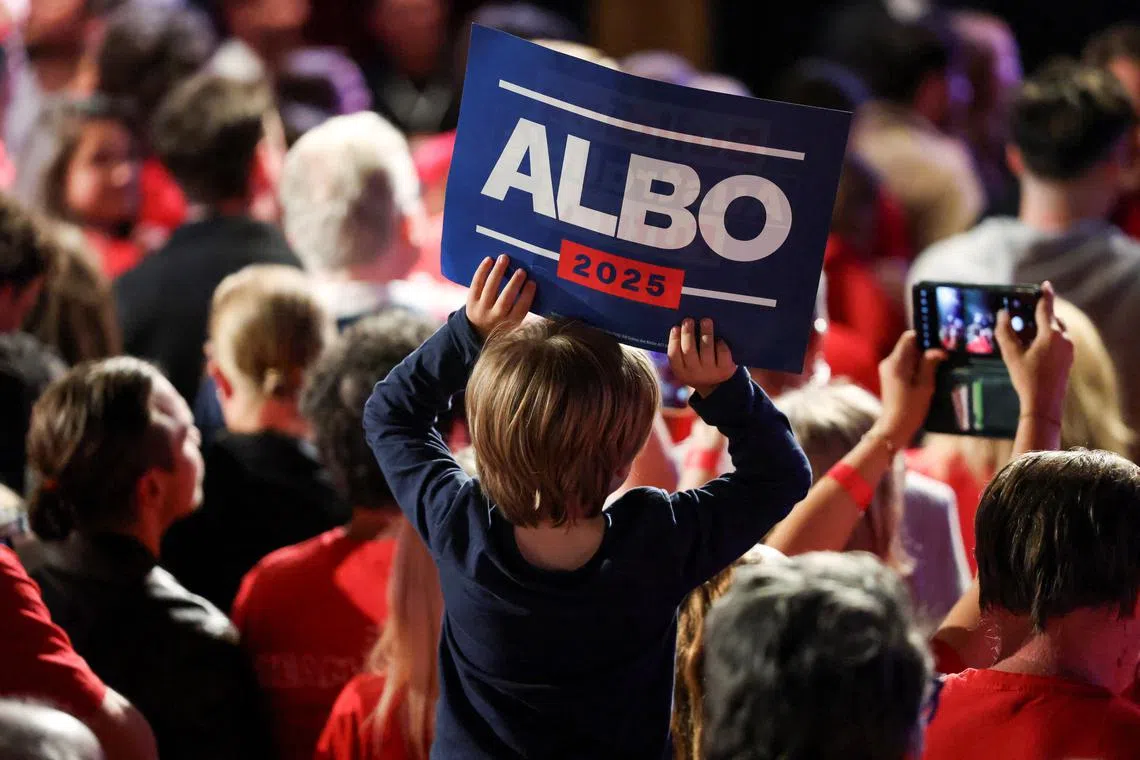 FILE PHOTO: A child holds a placard at a Labor party election night event, on the day of the Australian federal election, in Sydney, Australia, May 3, 2025. REUTERS/Hollie Adams/File Photo
