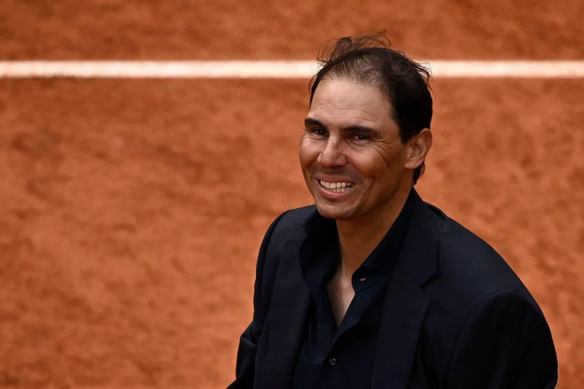 Rafael Nadal smiles during a ceremony honoring his career at the French Open tennis tournament in Paris, on May 29.