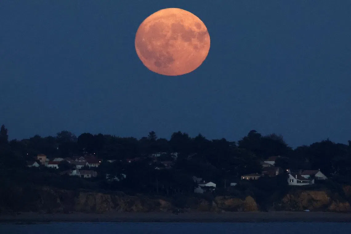A supermoon, known as the "Blue Moon" appearing in Pornic, France, on Aug 30, 2023. 