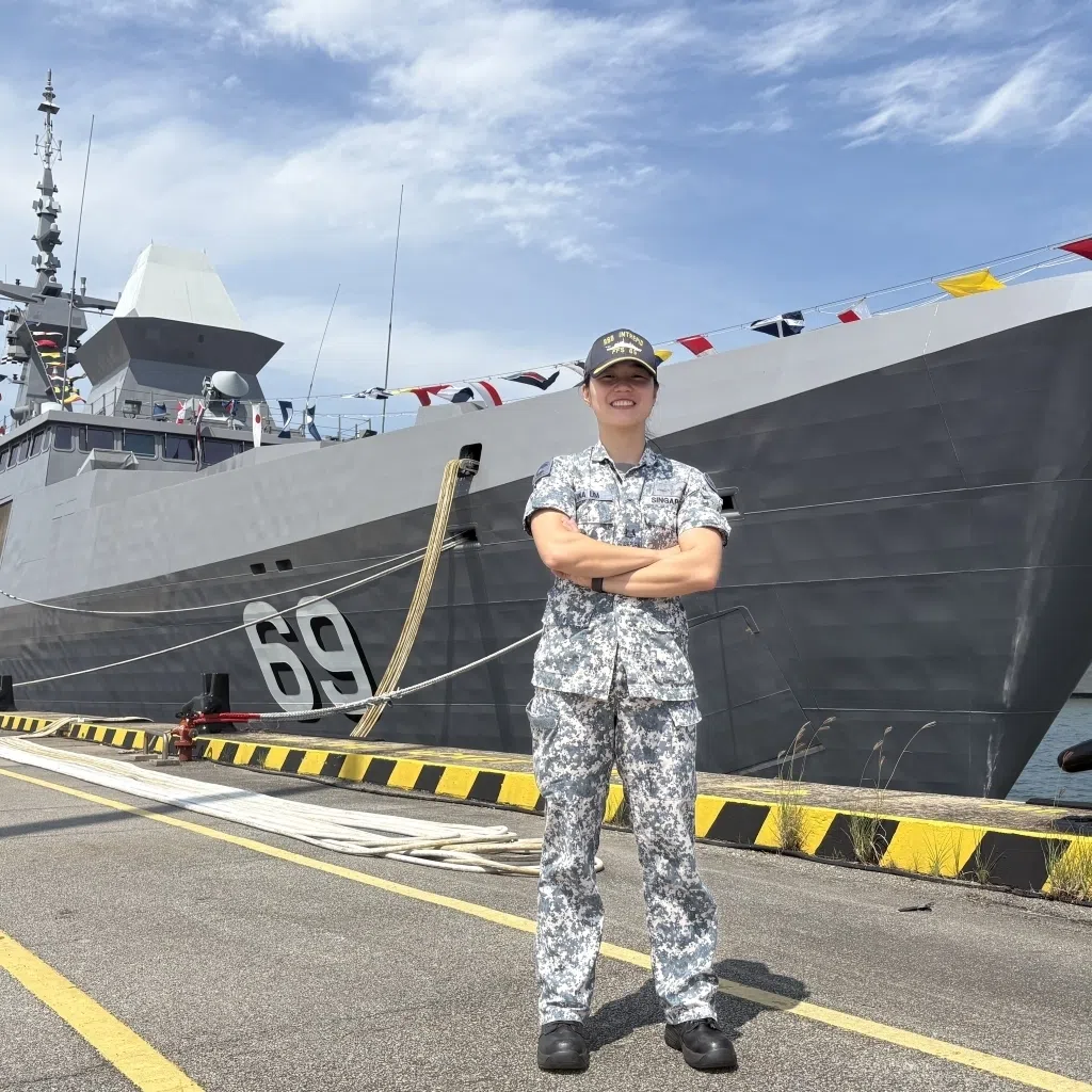 saf scholar major jina lim in front of singapore navy rss intrepid, first major overseas mission
