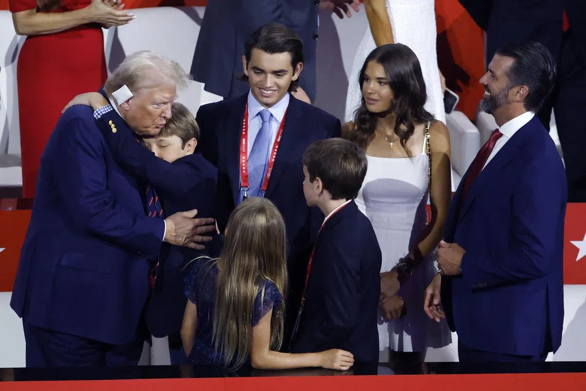 Donald Trump interacts with Kai Madison Trump, Donald Trump Jr. and members of his extended family on Day 3 of the Republican National Convention, on July 17.