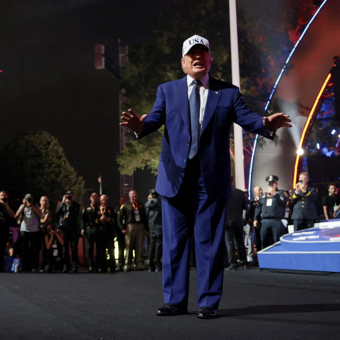 US President Donald Trump gestures as he departs after attending UFC Freedom 250 on the South Lawn of the White House in Washington DC.