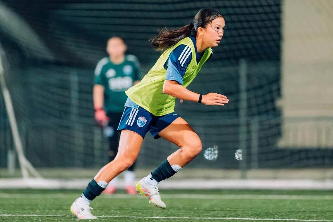 a lion city sailors girls academy player sprints during a football training session