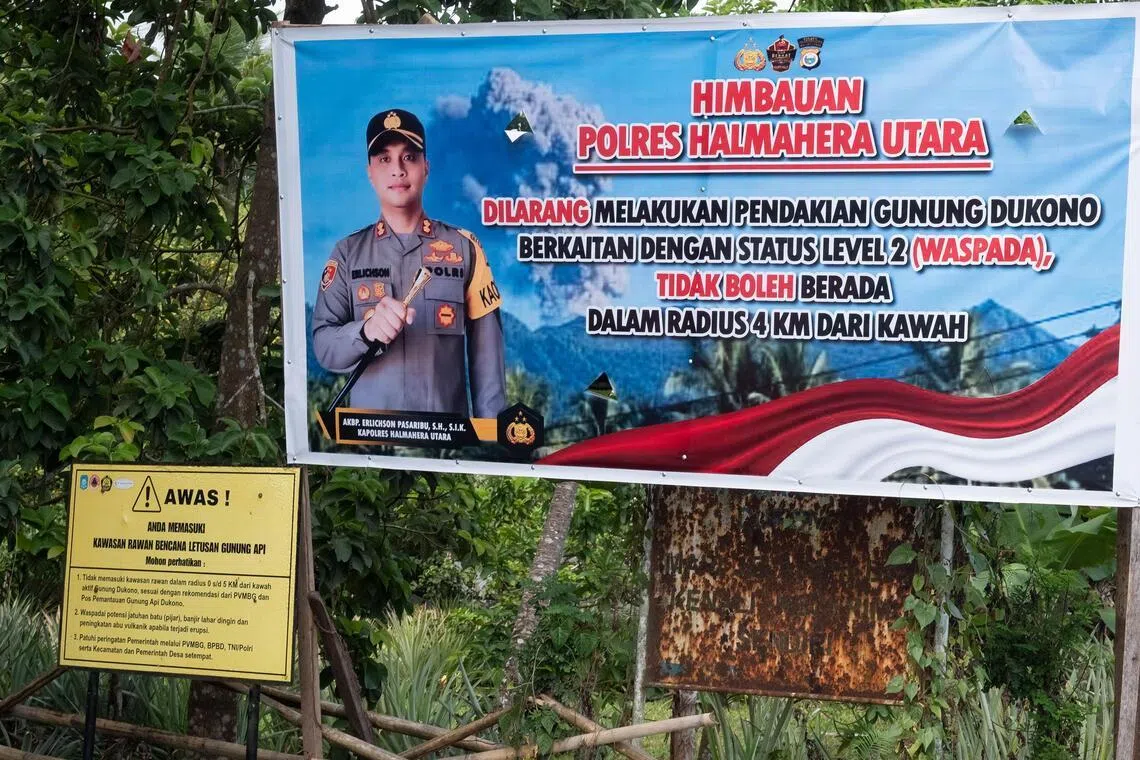 A banner from the North Halmahera police, which appears to be new, showing a prohibition for hikers, at the entrance of the main route towards Mount Dukono from Mamuya village on May 10.